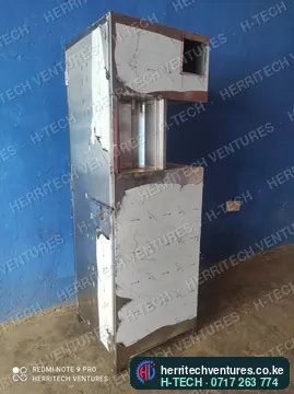A stainless steel cooking oil ATM body fresh from fabrication, protective film still on, December 2021